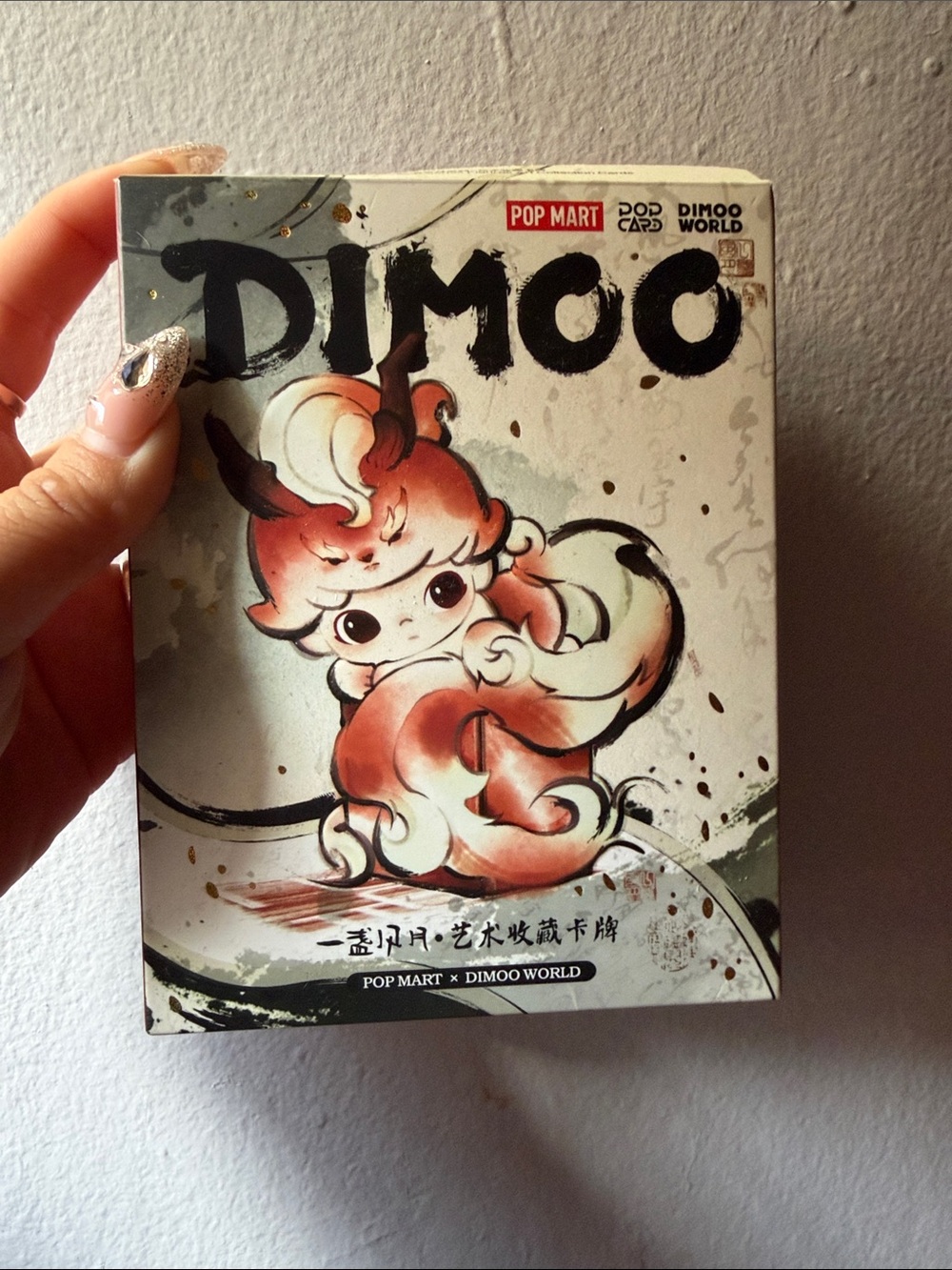Dimoo Pop Mart collectible box - Cream & Coral artwork